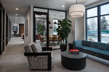 A living room with couches and chairs and a table